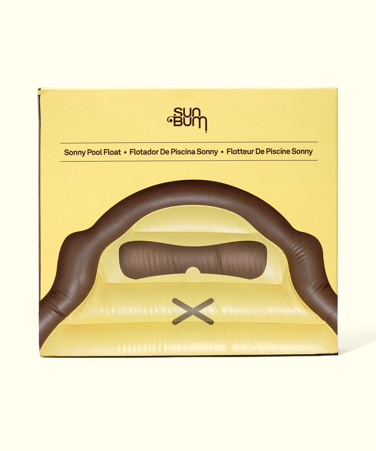 Yellow and brown Sonny Pool Float in packaging for relaxing water fun by Sun Bum.