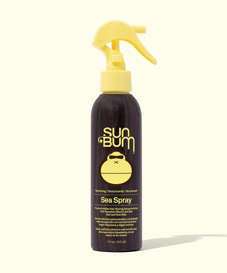 Sun Bum Sea Spray bottle with yellow nozzle on a white background