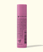 Pink lip balm tube with text on a white background