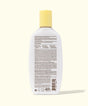 Bottle of Sun Bum sunscreen with a white label on a white background