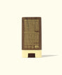 Sun Bum sunscreen stick with brown and beige design on a white background