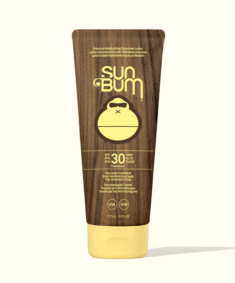 Sun Bum sunscreen tube with wooden design on a white background