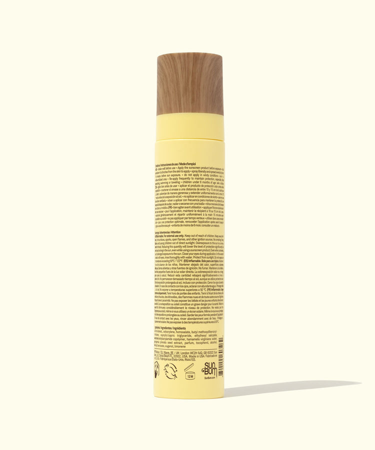 Shampoo bottle with a wooden cap on a white background