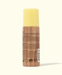 Sunscreen spray bottle with yellow cap and wooden texture on a white background