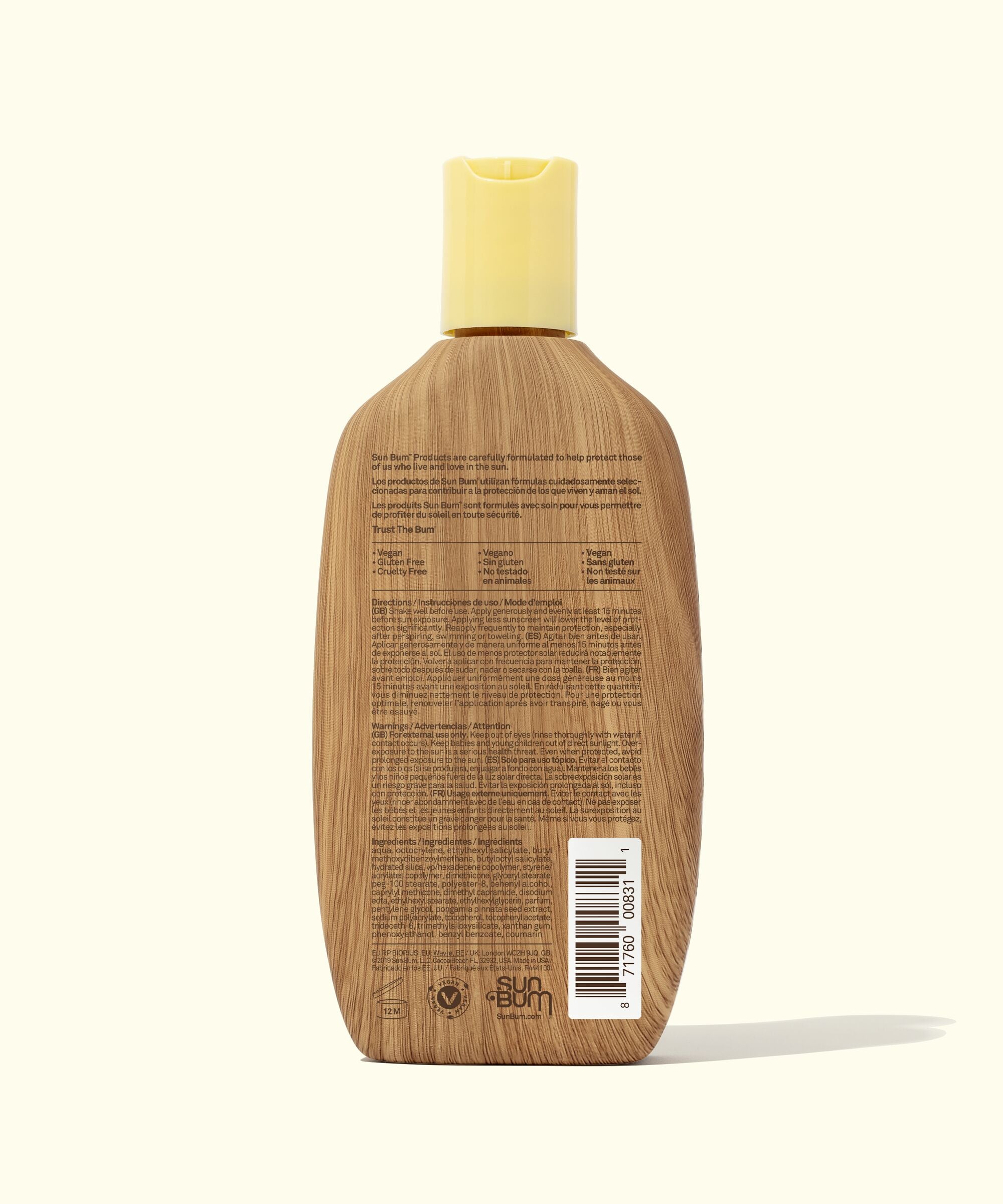 Wooden bottle with a yellow cap on a white background