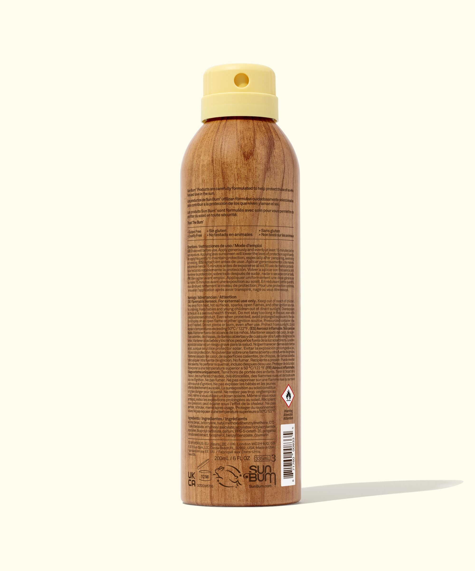 Wooden spray bottle with a beige cap on a white background