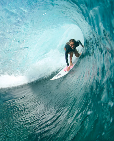 Person surfing inside a wave tunnel